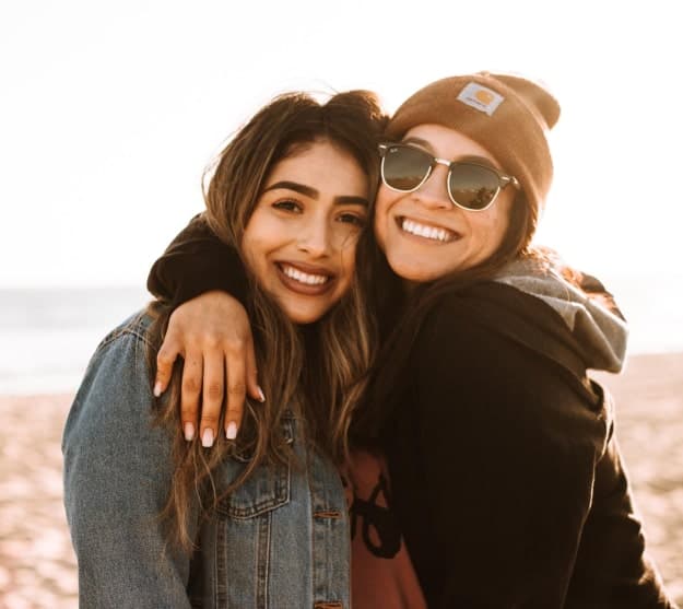 Two women smiling.